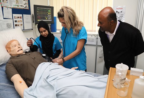 Students working with simulated patient