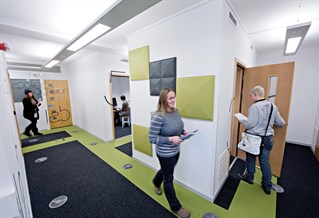 Students walking through psychology labs