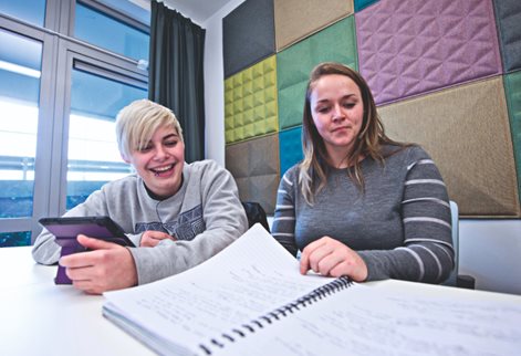 Psychology students reviewing notes