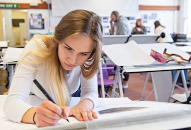 architecture student working in the studio