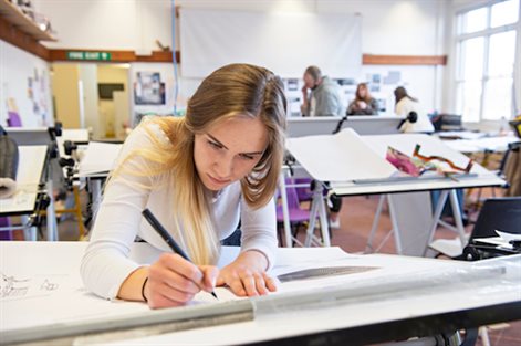 architecture student working in the studio