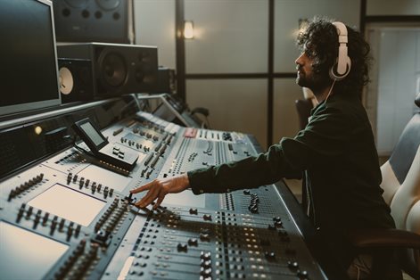 Person mixing in a recording studio