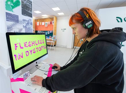 student prepares their graduation show work on an apple computer