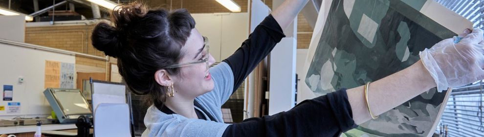 student holding a print