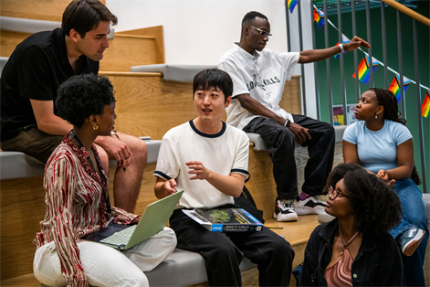 PG students sitting in a group talking