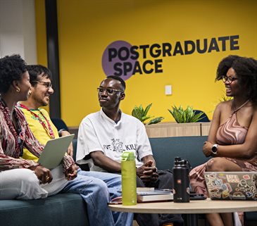 Students sitting together in the postgraudate study space