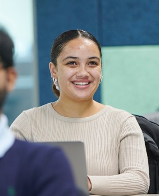 Student laughing in a seminar