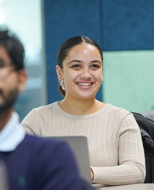 Student laughing in a seminar