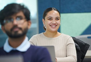 Student laughing in a seminar