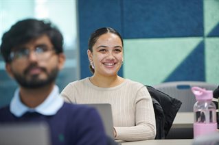 Student laughing in a seminar