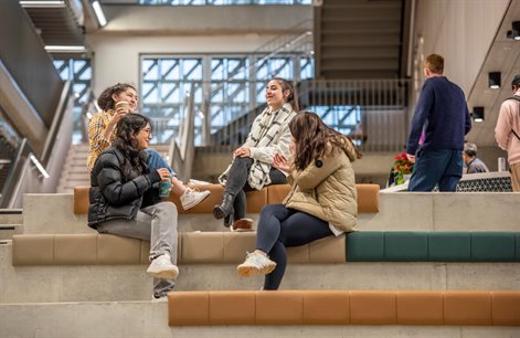 Students on steps by Elm House cafe