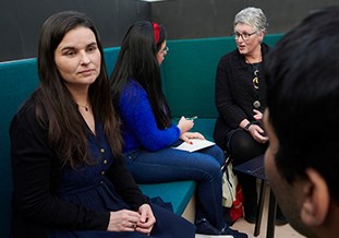 Group of people chatting in an office