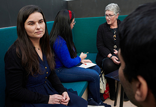 Group of people chatting in an office