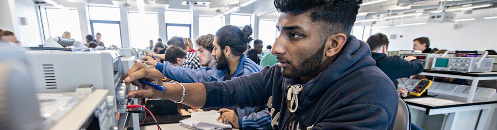 A room of engineering students conducting electrical experiments