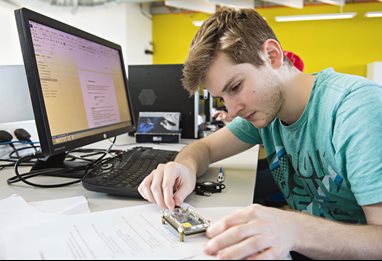 Engineering student working on circuit 