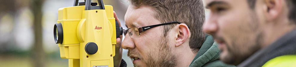 Civil Engineering students using a viewfinder