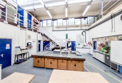 Image of civil engineering laboratory, showing a large room with a standalone island and specialist equipment