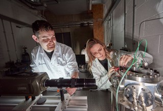 Two students working in an engineering lab