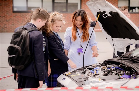 trainee teacher on a field trip with secondary pupils