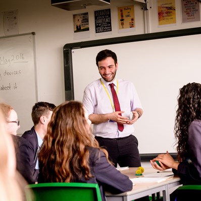 Teacher in classroom with pupils