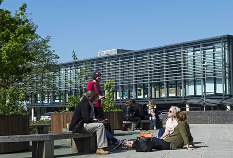 Students enjoy the sunshine on the Falmer campus