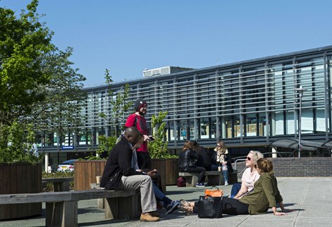 students sitting outside on Falmer campus
