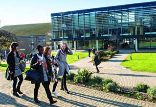 Students walking in front of buildings