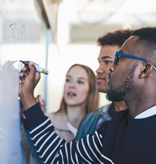 Students writing on a wipe board