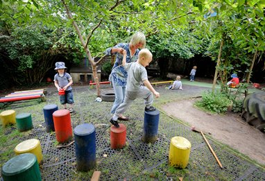 children at nursery playing outside