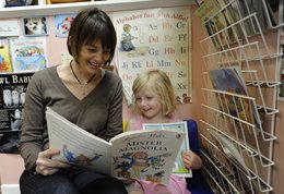 Child reading at nursery
