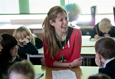 Primary school teacher and pupils