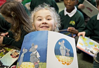 primary school girl with reading book