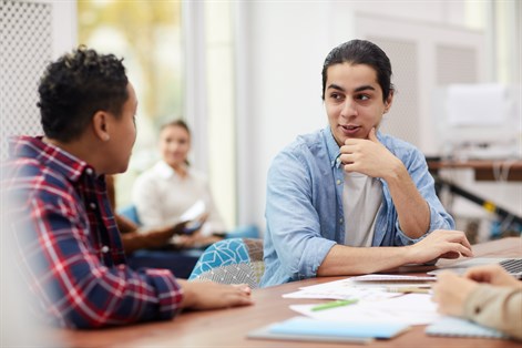 Students talking in library