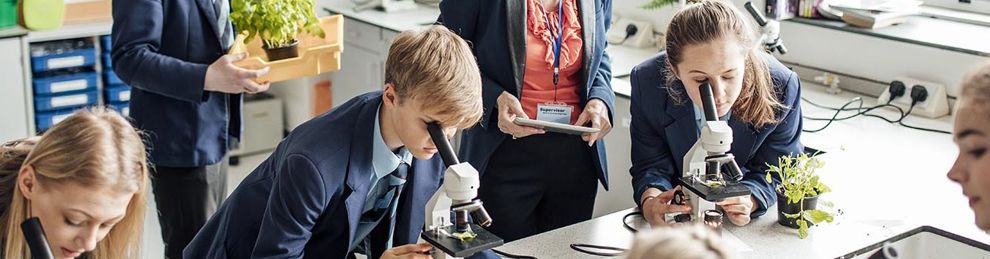 teacher and students in a science lesson