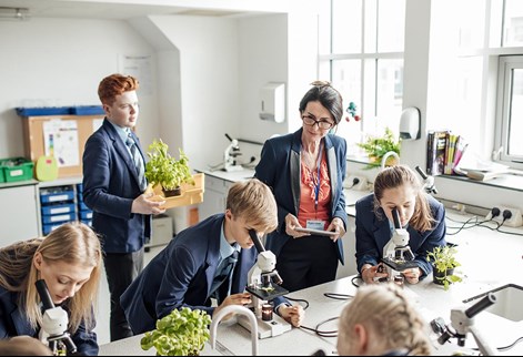 Teacher and students in a science lesson