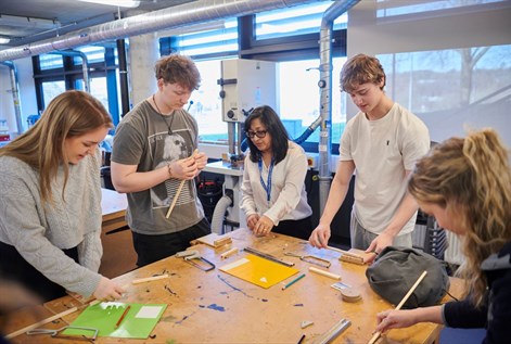 Primary D&T students in workshop with teacher