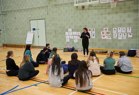 Primary PE QTS students on floor