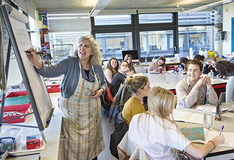 female lecturer with students in the art class