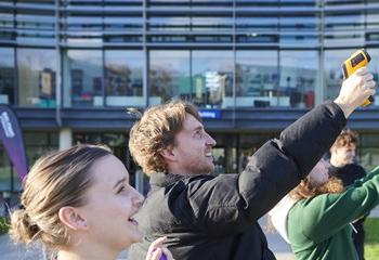 Group of geography PGCE trainee teachers using specialist equipment