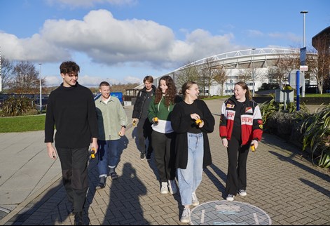 group of students walking through Falmer campus