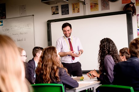 trainee teacher teaching in classroom setting