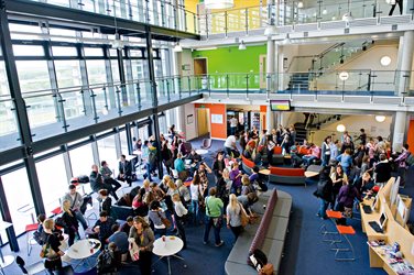 Students in the hall of the Checkland Building at Falmer