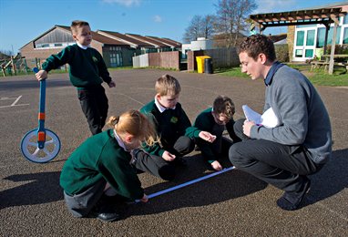 Children and teacher in a playground