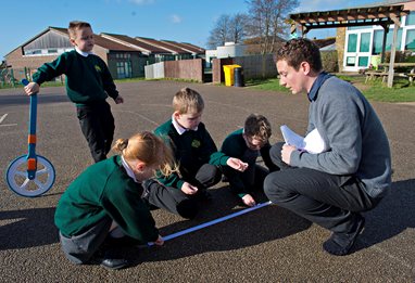 Children and teacher in a playground