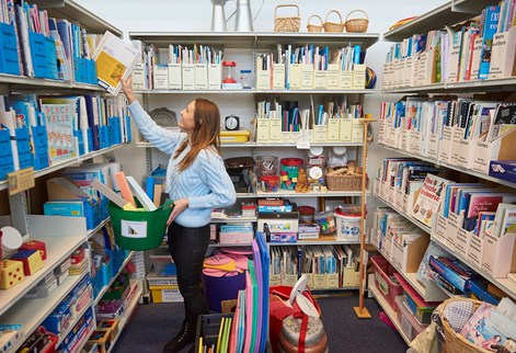 Education student looking at curriculum centre resources