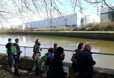 People by the end of a river