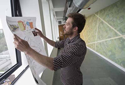 Student examining architectural plans