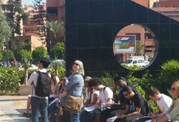 Students sitting in the sun