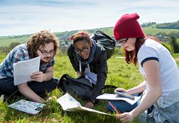 Three student on an ecology field trip