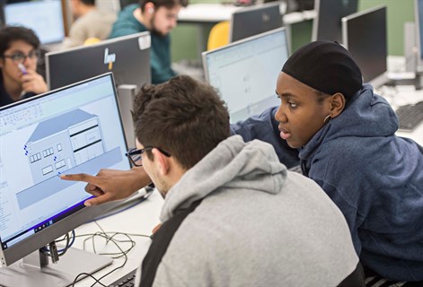 Students studying BIM architectural diagrams on the computer